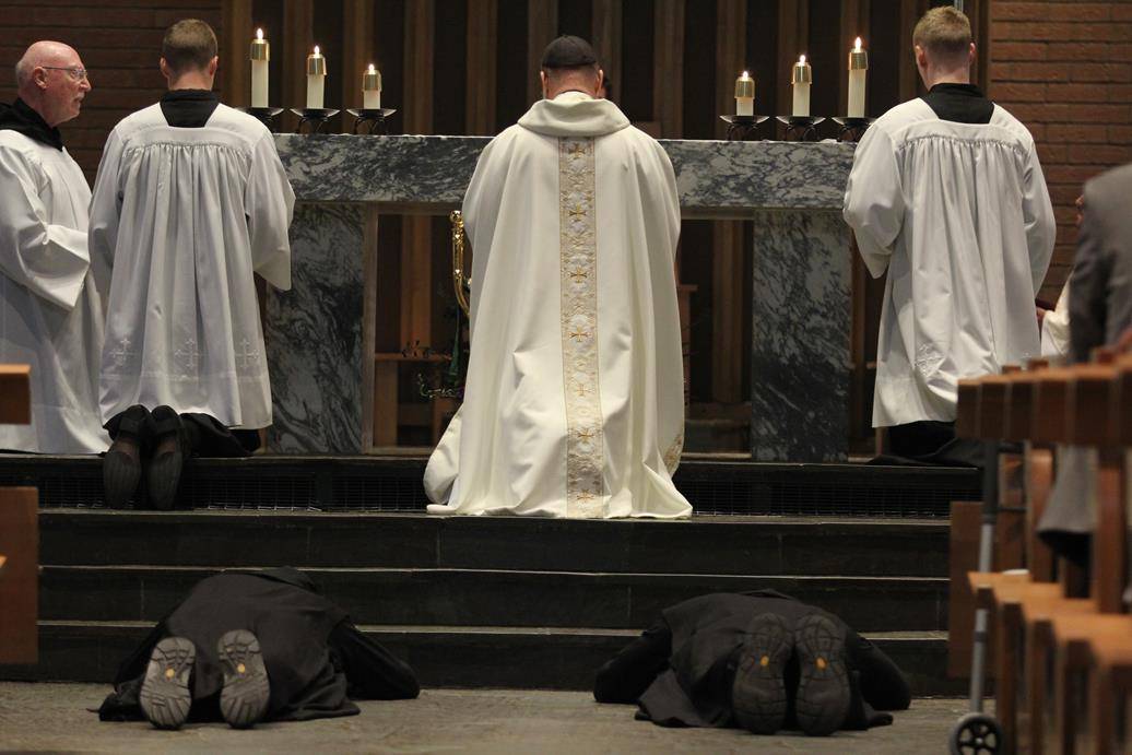 Two Benedictine monks make solemn profession on feast of St. Benedict