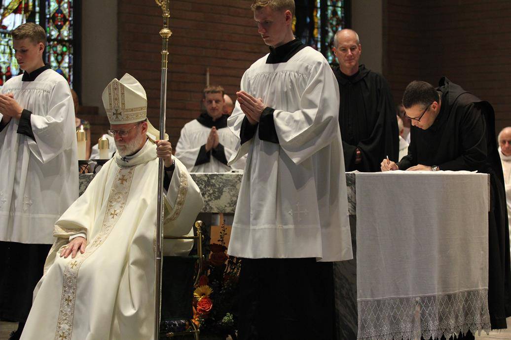 Two Benedictine monks make solemn profession on feast of St. Benedict