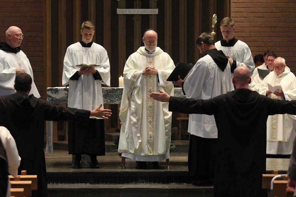 Two Benedictine monks make solemn profession on feast of St. Benedict