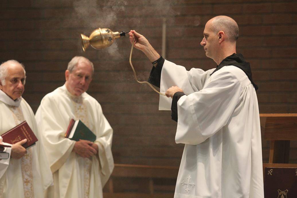 Two Benedictine monks make solemn profession on feast of St. Benedict