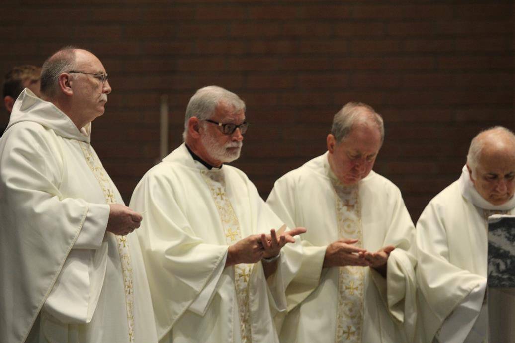 Two Benedictine monks make solemn profession on feast of St. Benedict