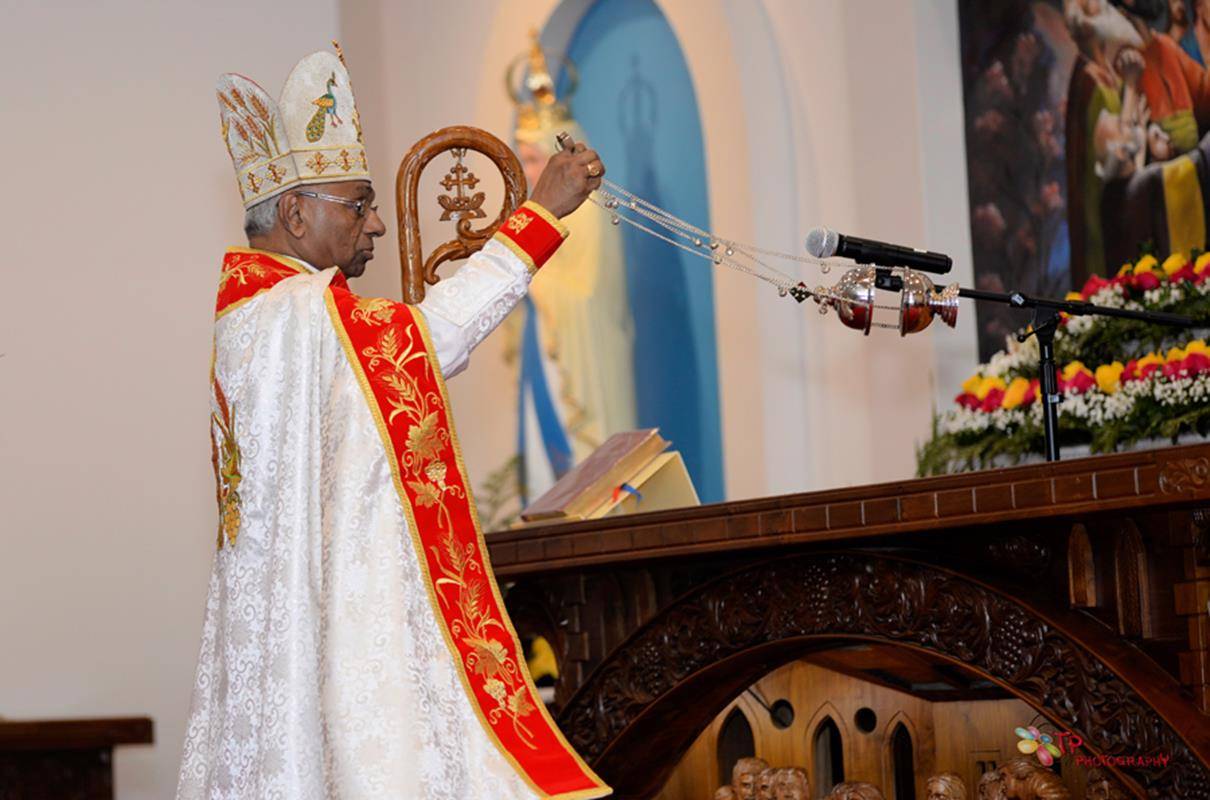 Bishop Jacob Angadiath censes and then anoints with sacred chrism the high altar in the sanctuary of the church.