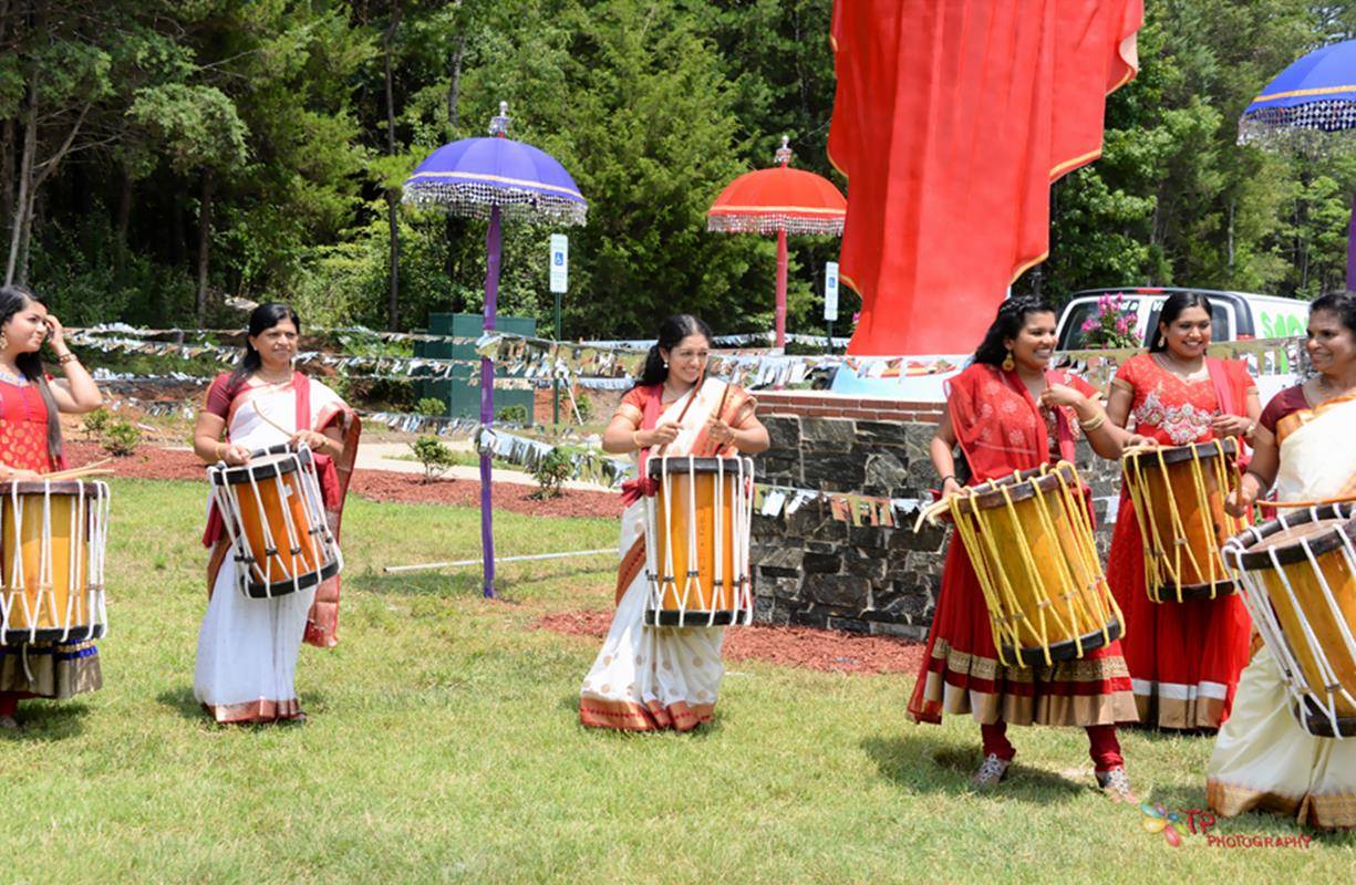 Parishioners celebrated the church’s consecration with traditional Indian music and food after Mass.