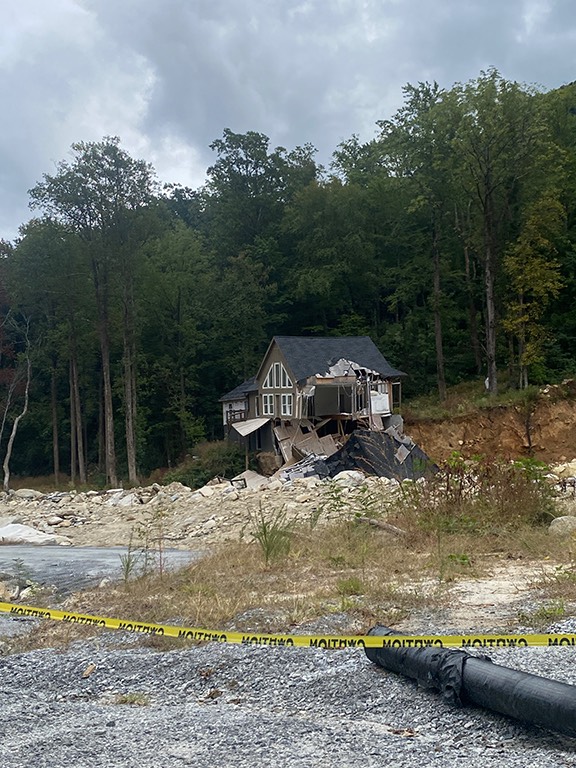 As of October 2025, many areas such as this street in Chimney Rock, remained untouched.