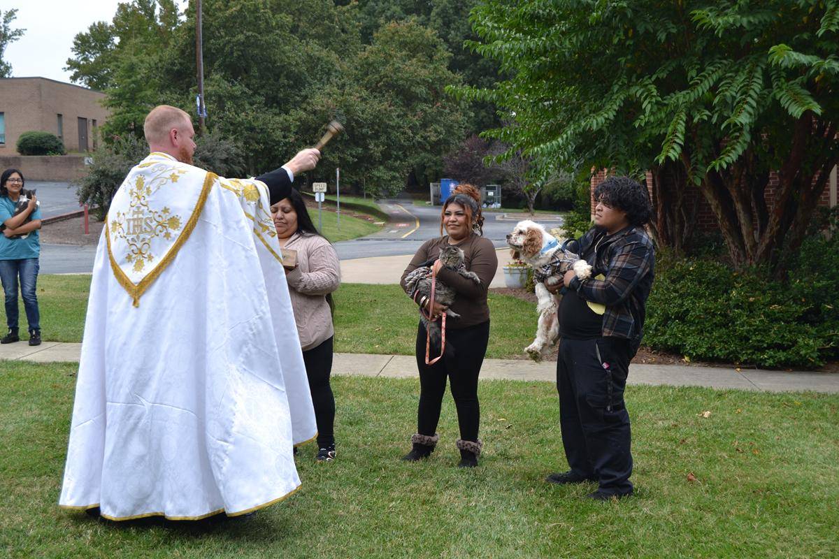 Father Noah Carter, pastor of Holy Cross Parish blessed all types of pets and their owners in Kernersville Saturday. 