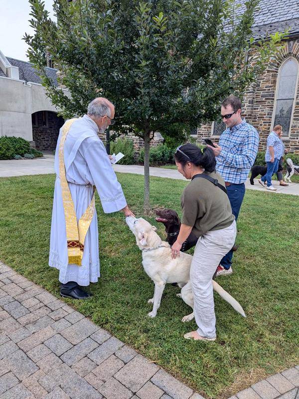 Deacon Ralp blesses happy animals at St. Leo the Great Church in Winston-Salem. 