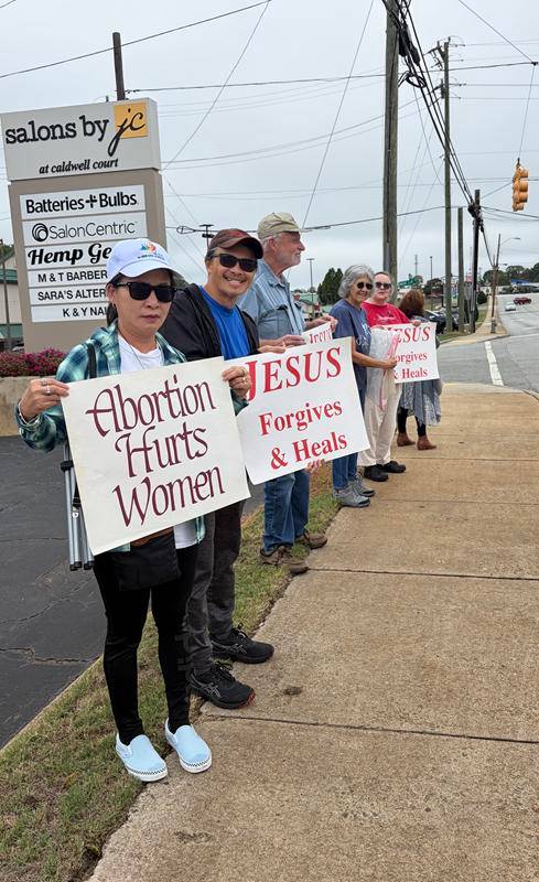 Parishioners from Our Lady of Grace and St. Pius X parishes in Greensboro were joined by the Knights of Columbus and Boy Scouts to stand up for life in their city.