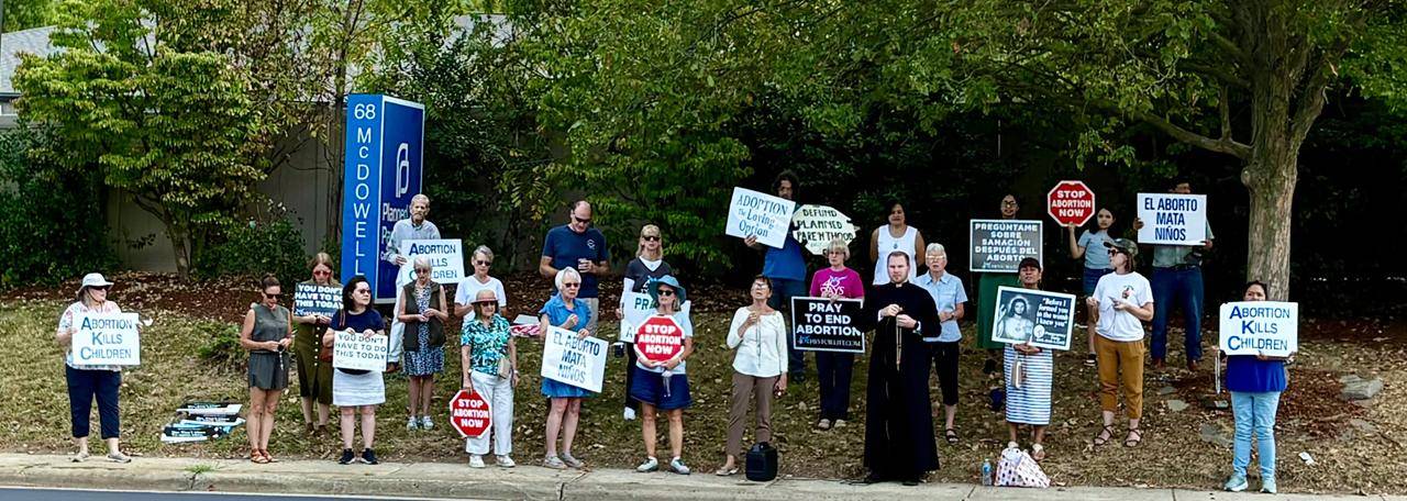 Father Aaron Huber leads the 40 Days for Life kickoff on in Asheville. May St. Mary Margaret parishioners attended.