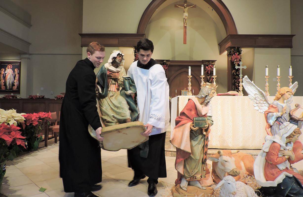 HUNTERSVILLE — Seminarians helped St. Mark Church add the wisemen, Caspar, Melchoir and Balthazer to the nativity for Epiphany. The heavy Fontanini statues stand 50 inches tall and are made of marble and resin. (Photos provided by Amy G. Burger)