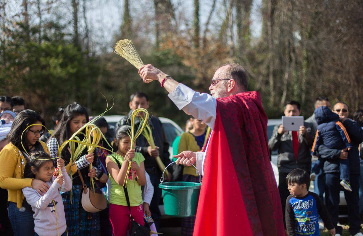 MORGANTON — Members of St. Charles Borromeo Church take part in a Palm Sunday procession March 25. (Photos by Lorenzo Pedro, correspondent)