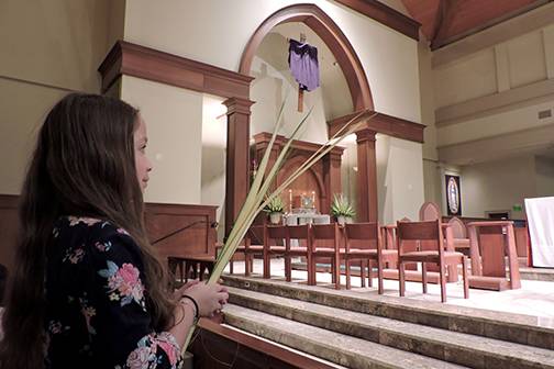 HUNTERSVILLE — Parishioners including Cassidy Bischoff at St. Mark Church usher in Holy Week with the vigil Mass for Palm Sunday March 24. (Photo provided by Amy Burger)