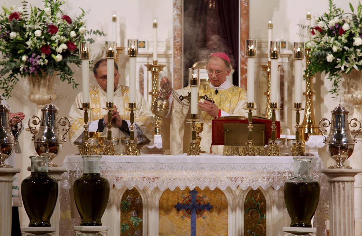 Bishop Jugis incenses the altar during Mass.