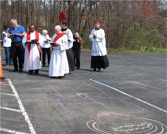 The youth group at Good Shepherd Mission in King drew in chalk a set of outdoor Stations of the Cross for Good Friday. (Photo by Annette Tenny, correspondent)