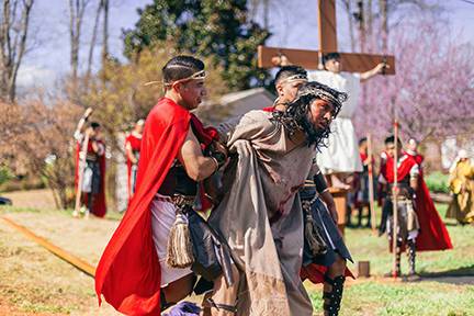 Jesus is led to the cross during the Via Crucis staged at St. Charles Borromeo Church in Morganton (Photo by Lorenzo Pedro, correspondent)