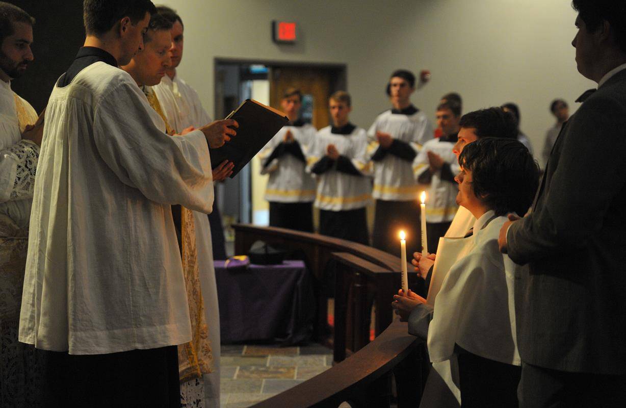Mass in the Extraordinary Form celebrated at Charlotte Catholic High School chapel. There were two catechumens baptized at the Mass, Philip Kelly and Dakota Charles. (Photo provided by Markus Kuncoro)