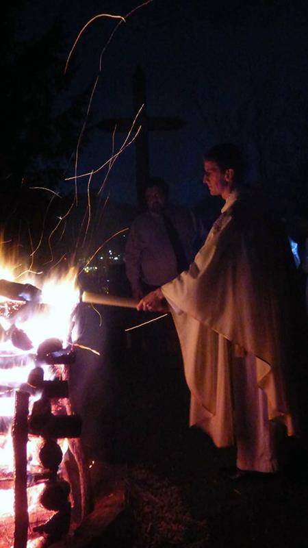 Fr. Matthew Codd lights the Paschal candle during the Easter Vigil at St. Elizabeth Church in Boone (Photo by Amber Mellon, correspondent) 
