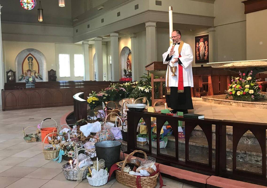 Blessing the Easter baskets at St. Mark Church in Huntersville. (Photo provided by Amy Burger)
