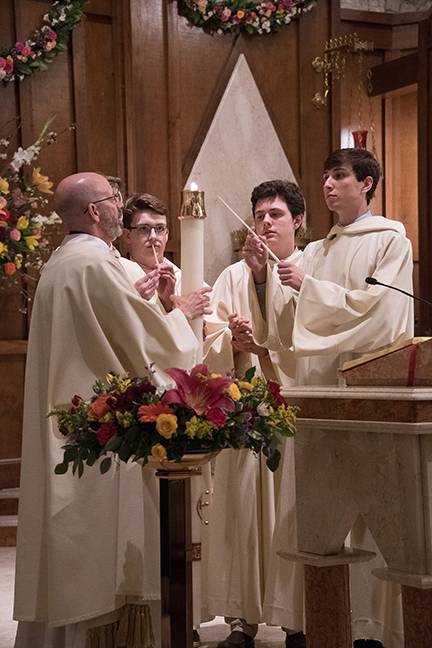 Lighting of the Paschal candle at St. Pius Church in Greensboro (Photo provided by MaryAnn Luedtke Photography)