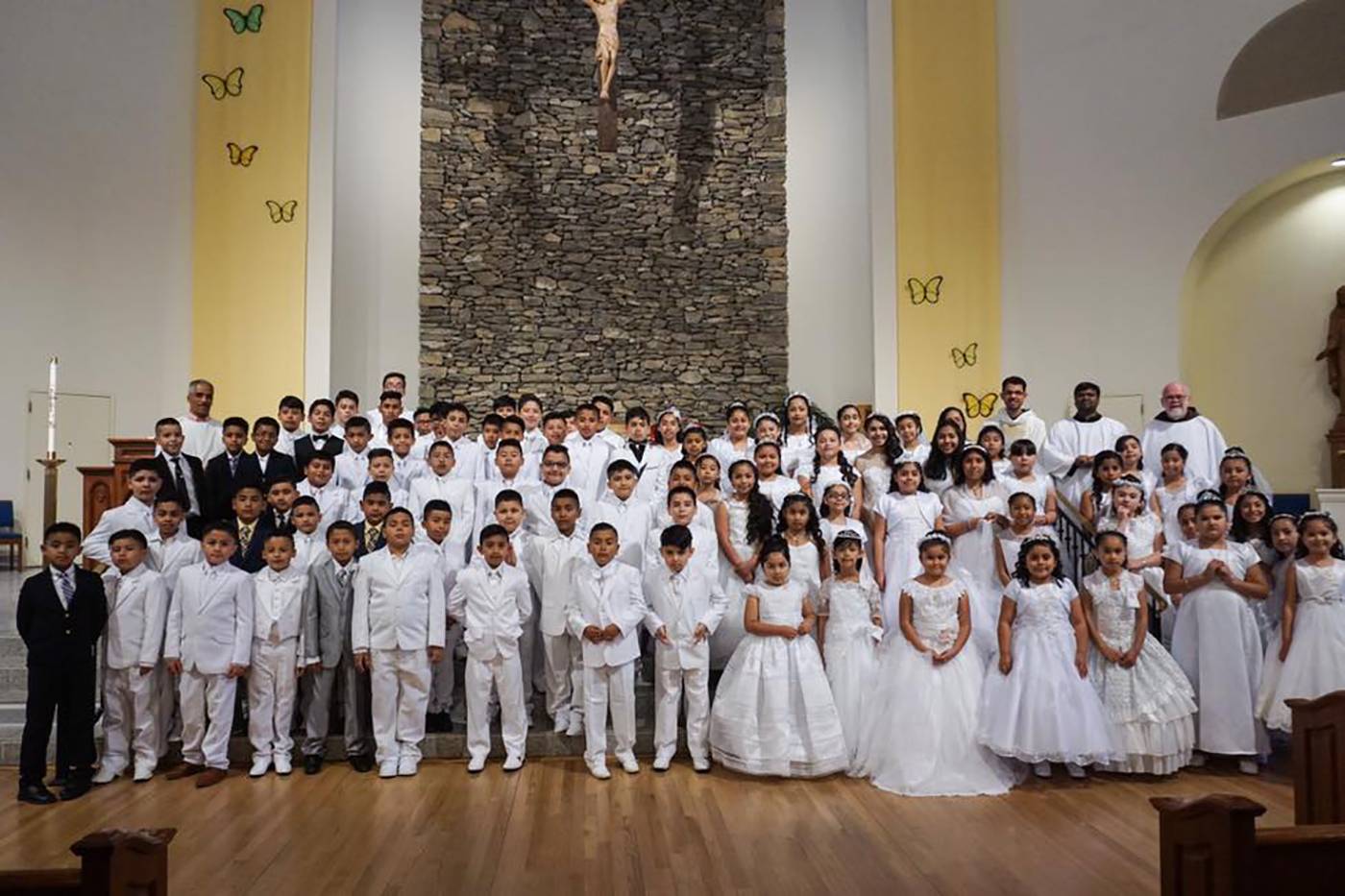 HENDERSONVILLE — More than 80 children received their first Holy Communion May 19 during a Spanish-language Mass celebrated at Immaculate Conception Church. (Photo provided by Mente Visual Films)