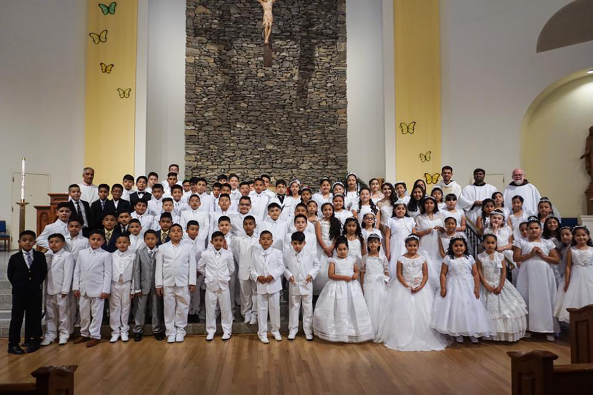 HENDERSONVILLE — More than 80 children received their first Holy Communion May 19 during a Spanish-language Mass celebrated at Immaculate Conception Church. (Photo provided by Mente Visual Films)
