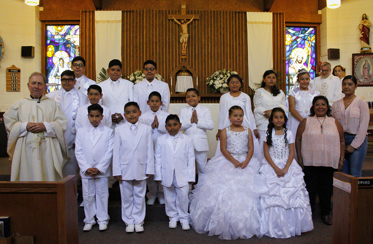 MARION — Young people received the sacrament of first Holy Communion May 6 during Mass at Our Lady of the Angels Mission offered by Father Carl Kaltreider, parochial administrator. Receiving the sacrament were Daniel Magallan, Charlie Portillo, Christian