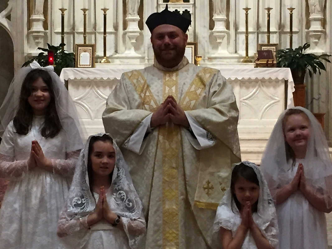 GREENSBORO — Children at Our Lady of Grace Church received their first Holy Communion in May during several Masses celebrated by Father Paul Buchanan, pastor, and Father Christian Cook, parochial vicar. (Photos provided by Melinda Stovall and Rachel Yarbr