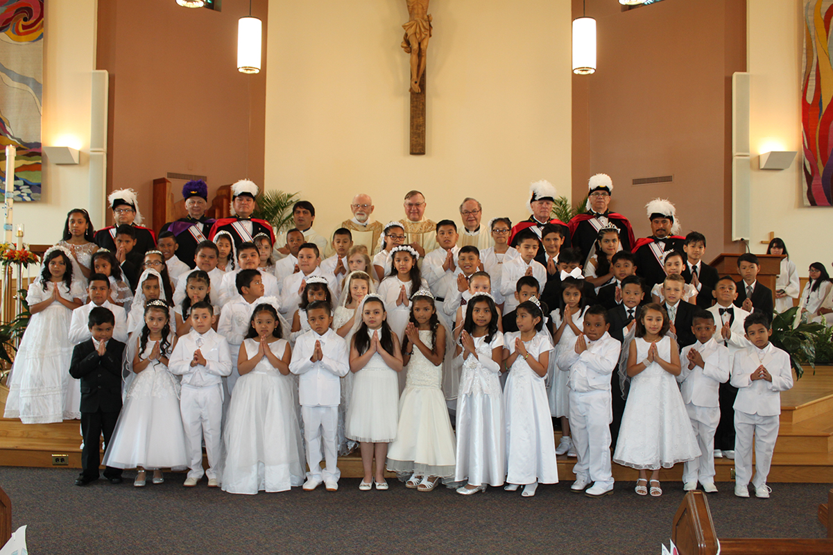 WINSTON-SALEM — Children at Our Lady of Mercy Church received their first Holy Communion during two Masses in May. After both Masses, children crowned a statue of Mary. (Photos provided by Jeanette Sprenkle)
