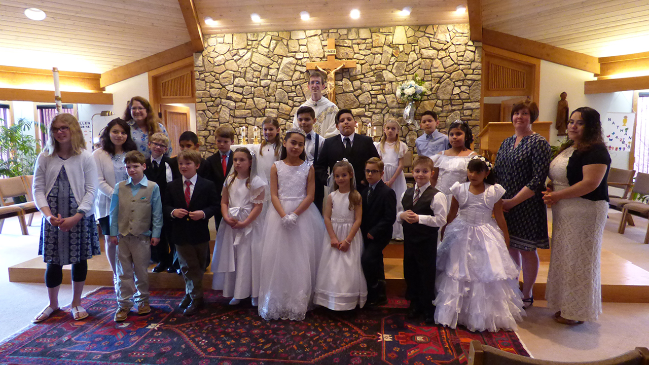 BOONE — St. Elizabeth Church welcomed several young people to the Lord’s Table at the vigil Mass on April 28. The Mass was celebrated by Father Matthew Codd, pastor. (Amber Mellon | Catholic News Herald)