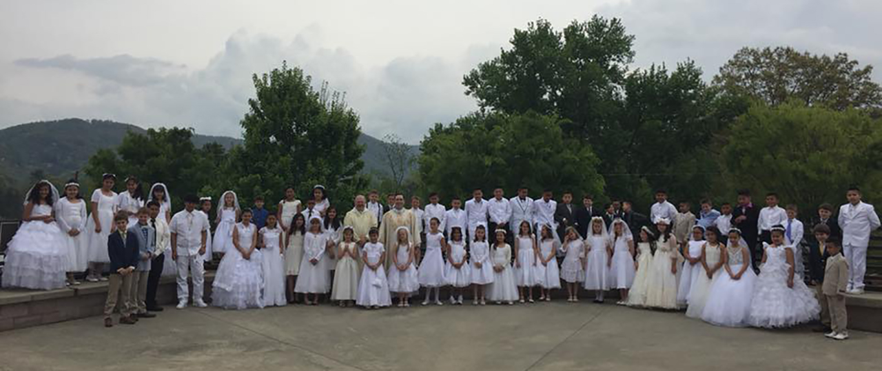 ASHEVILLE — A large group of children received their first Holy Communion during a recent Mass at St. Eugene Church, celebrated by Father Patrick Cahill, pastor. (Photo via Facebook)