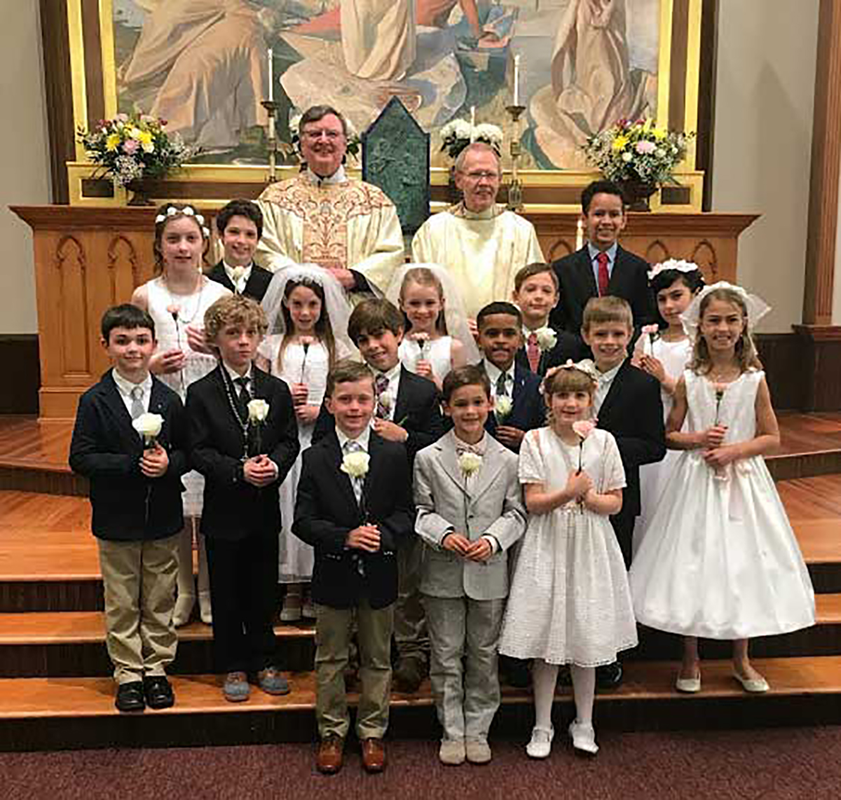 CHARLOTTE — Thirty-five children received their first Holy Communion during two Masses celebrated at St. Peter Church by Jesuit Father James Shea, pastor. (Photos provided by Cathy Chiappetta and Joan Guthrie)