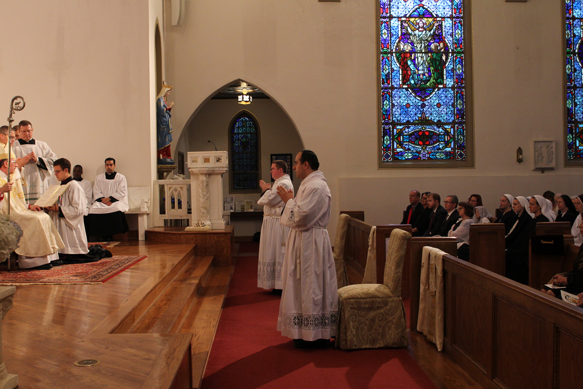 Bishop Jugis ordains two men to transitional diaconate June 2