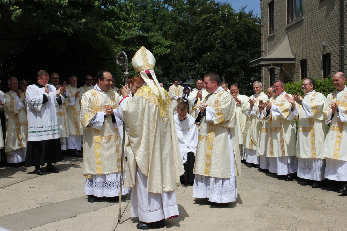 Bishop Jugis ordains two men to transitional diaconate June 2