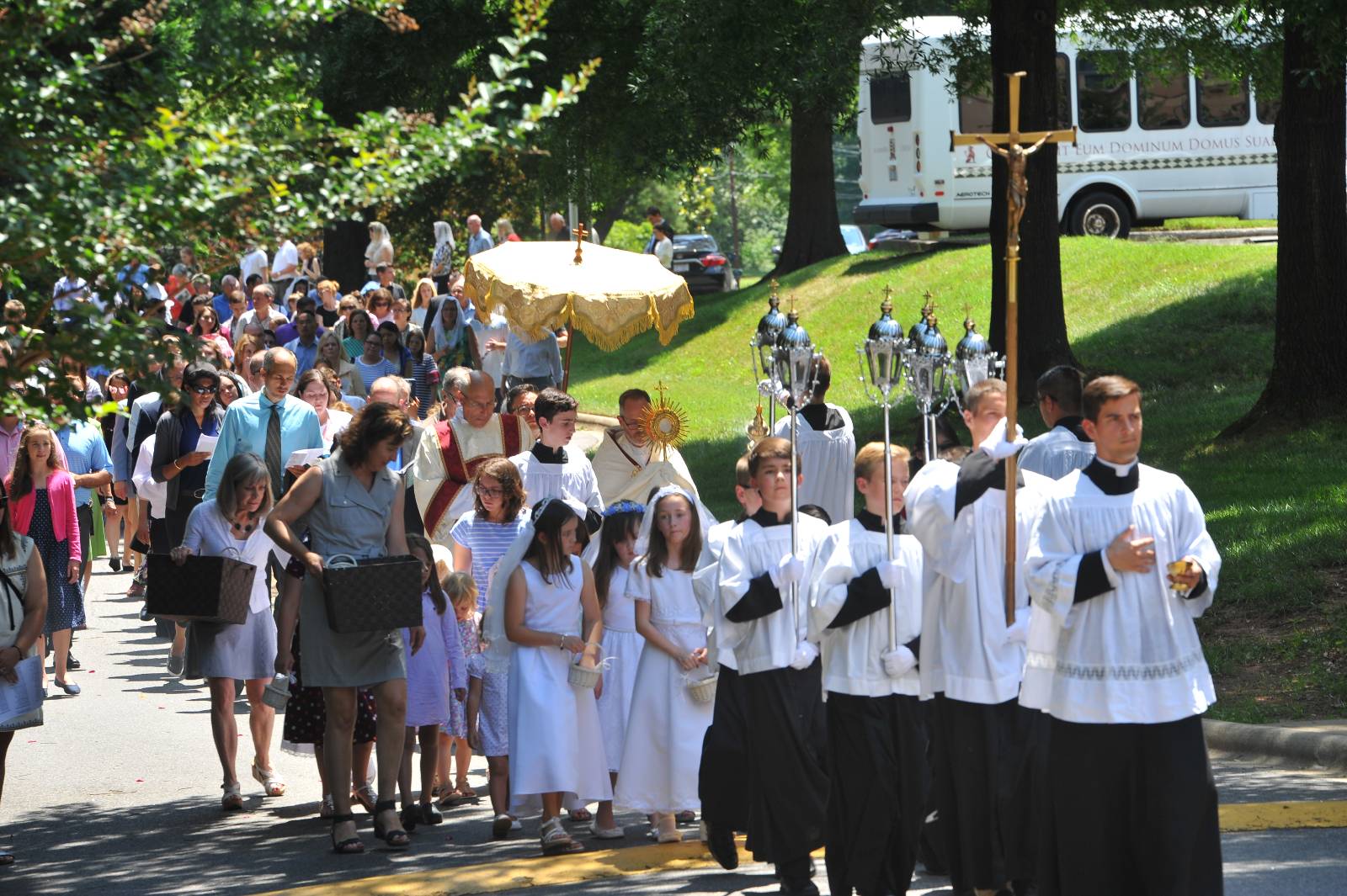 CHARLOTTE — Corpus Christi procession at St. Ann Church. (Photos by Markus Kuncoro)