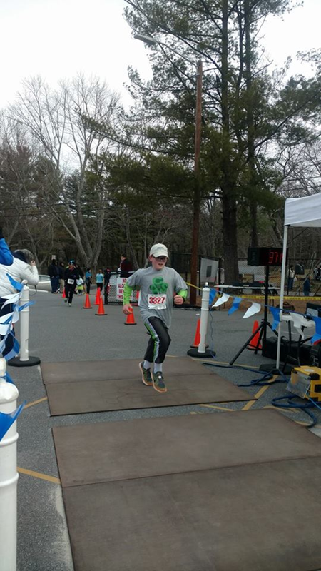 O'Brien crossing the finish line of the Shamrock Run March 2017.