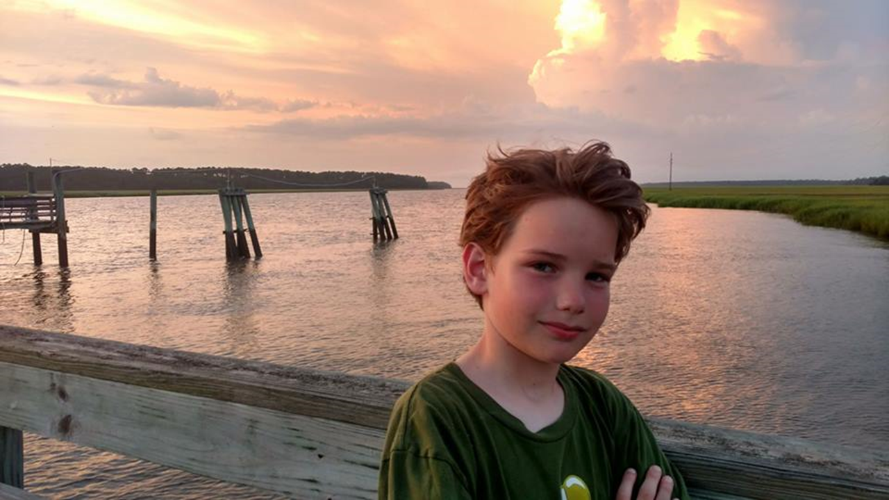 William Edward on Sapelo Island last summer. He loved this picture because he said the clouds behind him were the entrance to heaven.