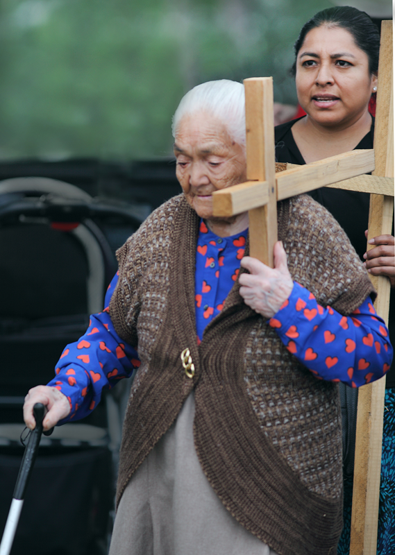 Maria Conception Perez Campos joins the procession along with her daughter-in-law, Roselia Mendoza.
