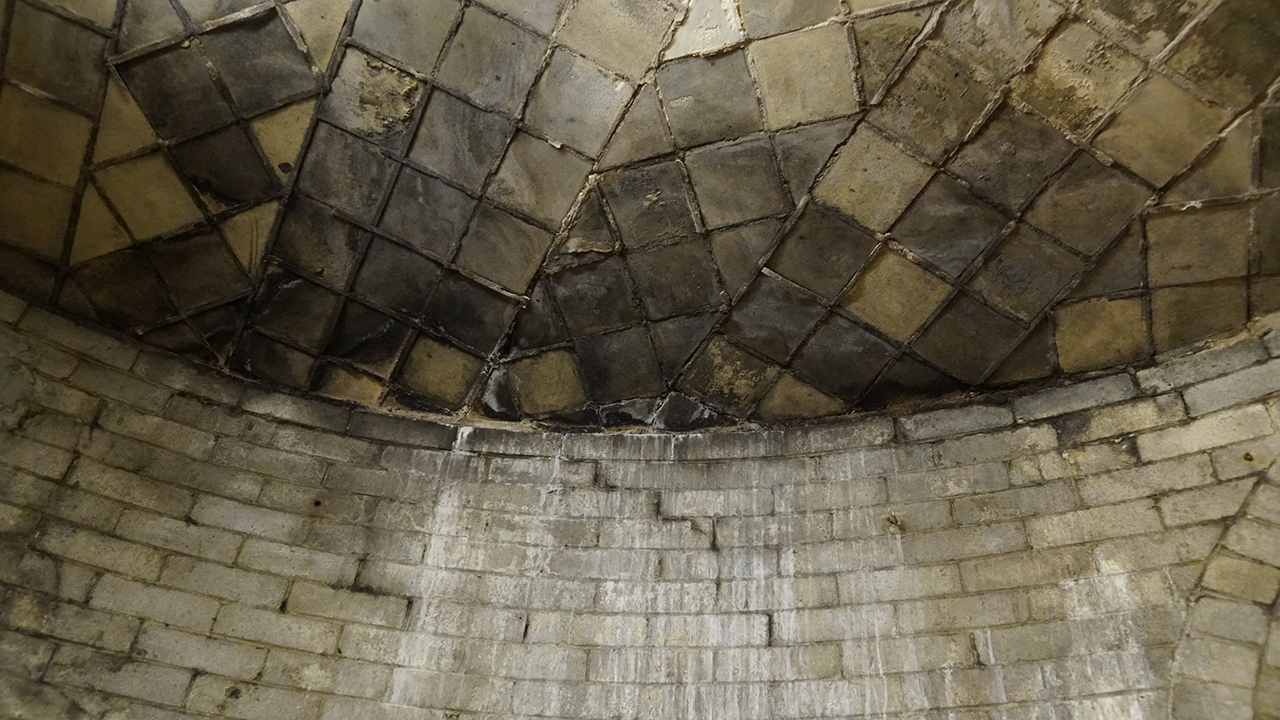 Moisture and smoke damage from years of incense are visible throughout the historic basilica.