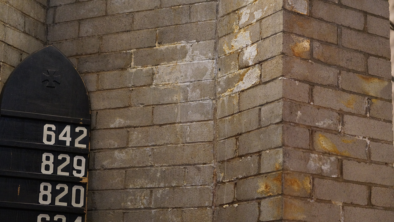 Moisture and smoke damage are also apparent on the walls of the choir loft.