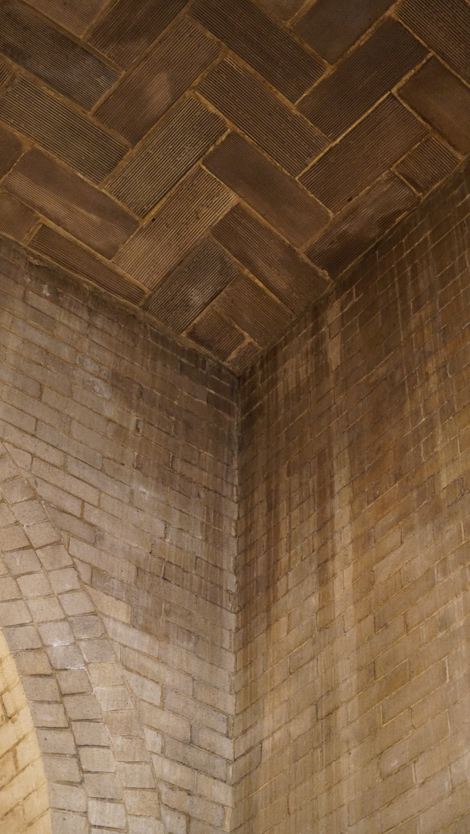 Moisture and smoke damage from years of incense are visible throughout the historic basilica, including the ceiling near the Adoration chapel.