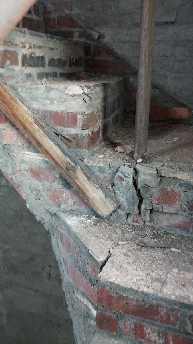 Cracks and worn-out brickwork have compromised the stairway up to the bell tower.