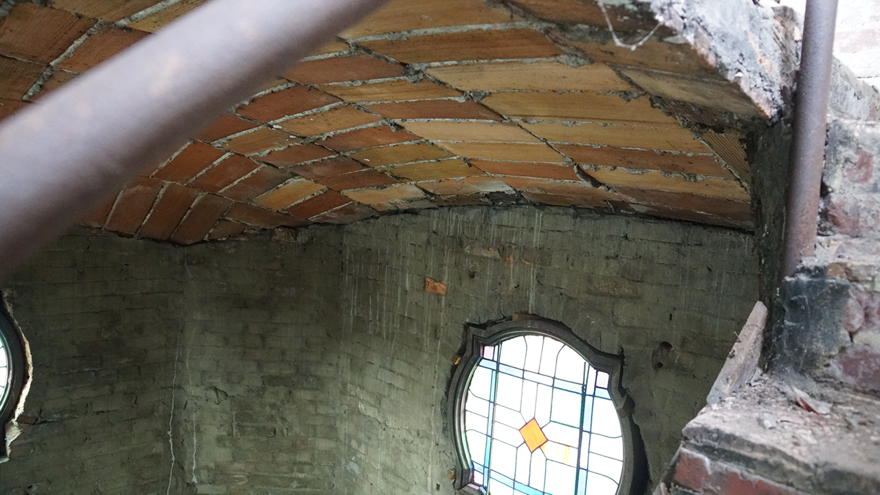 The original historic brickwork, tile and mortar can be easily seen inside the bell tower of the basilica.