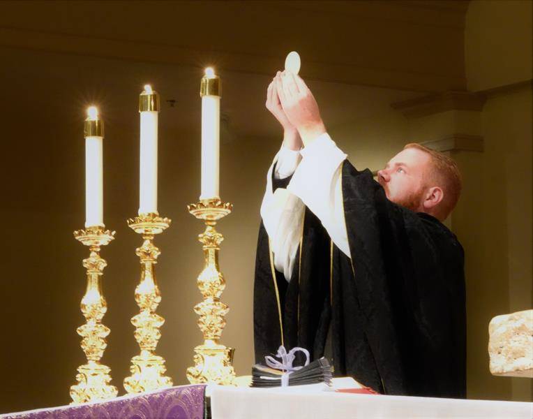 HUNTERSVILLE — A Mass of Remembrance was offered by Father Noah Carter at St. Mark Church Nov. 2. (Photos by Amy Burger)