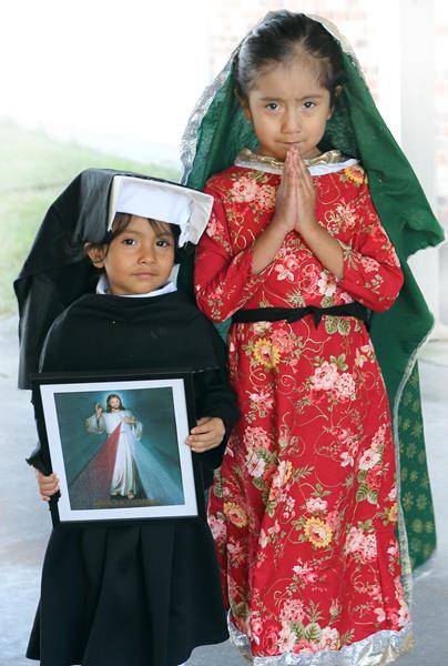 FOREST CITY — Children of Immaculate Conception Church dressed up as their favorite saints and Bible characters to celebrate All Saints' Day. Pictured are Emily Alonzo as St. Faustina and her sister Evelynn as Our Lady of Guadalupe. (Photos by Giuliana Po