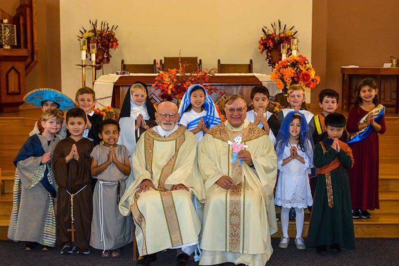 WINSTON-SALEM — Kindergarten All Saints' Day liturgy at Our Lady of Mercy School. The class with Father Carl Zdancewicz and Deacon Joe Schumacher. (Photos provided by Katrina Capistrano)