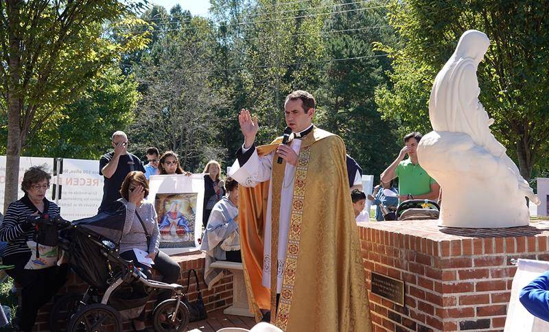 HUNTERSVILLE — Approximately 75 members of St. Mark Parish gathered around a statue of the Blessed Virgin Mary at noon Oct. 13 to commemorate the 101st anniversary of the Miracle of the Sun, performed by Our Lady of Fatima in 1917.
