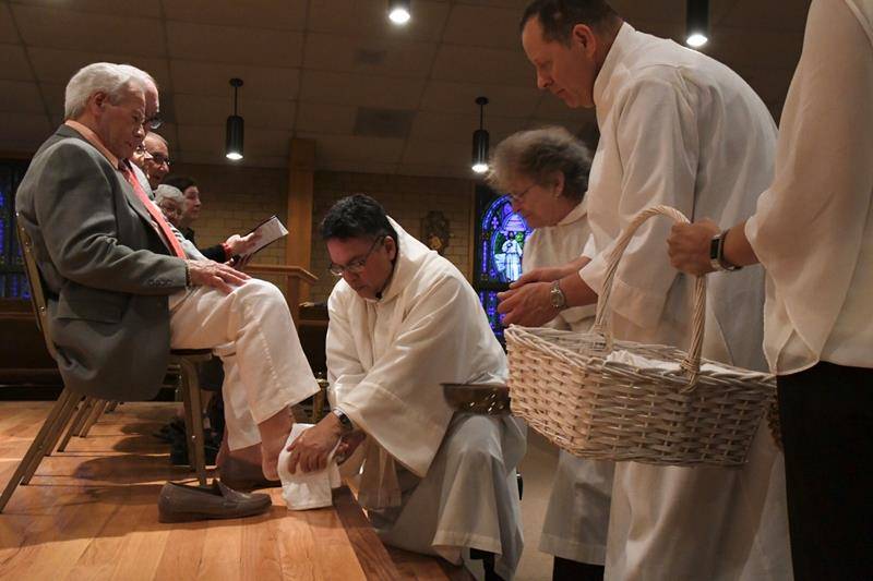 MURPHY — Washing of the feet during Holy Thursday services at St. William Church. (Photo by Phil Roche)