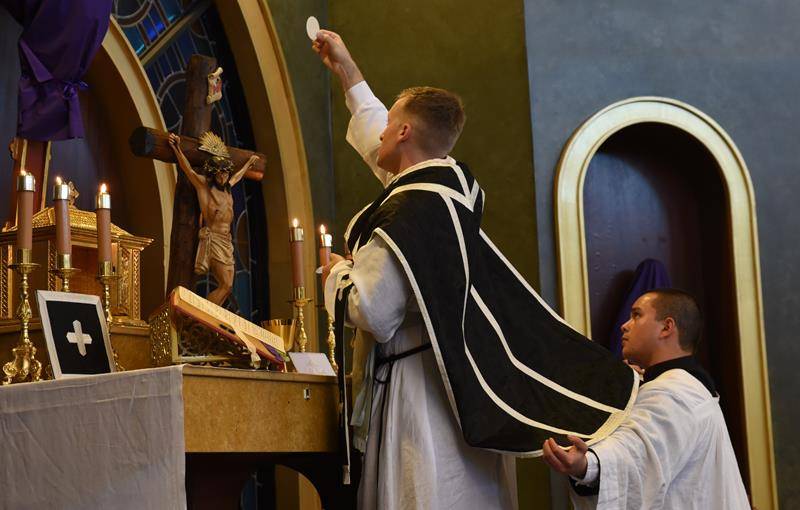 CHARLOTTE —Nearly 130 attendees joined St. Ann Church and the Charlotte Latin Mass Community in marking the second day of the Latin Easter Triduum, with the ancient Good Friday Mass of the Presanctified at Charlotte Catholic High School chapel. (Photo by 
