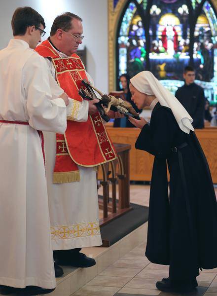 FOREST CITY — Good Friday service at Immaculate Conception Church in Forest City, began at 2:30 with the Stations of the Cross led by pastor Father Herbert Burke. It continued with the commemoration of Christ’s Passion and veneration of the cross. (Photo 