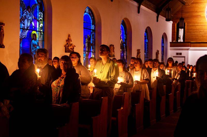 Parishioners gathered at the Easter Vigil at Our Lady of the Highways Church in Thomasville April 20, when they welcomed four new members into the parish community. (Photo by Joe Thornton)