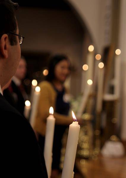 Newly baptized Catholics approach the altar to receive the sacrament of reconciliation by Bishop Peter Jugis at St. Patrick Cathedral at the Easter Vigil. (Photo by Patricia Guilfoyle)